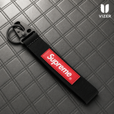 SUZUKI BLACK KEYCHAIN WITH METAL KEY RING