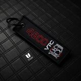 V8 BLACK/WHITE KEYCHAIN WITH METAL KEY RING